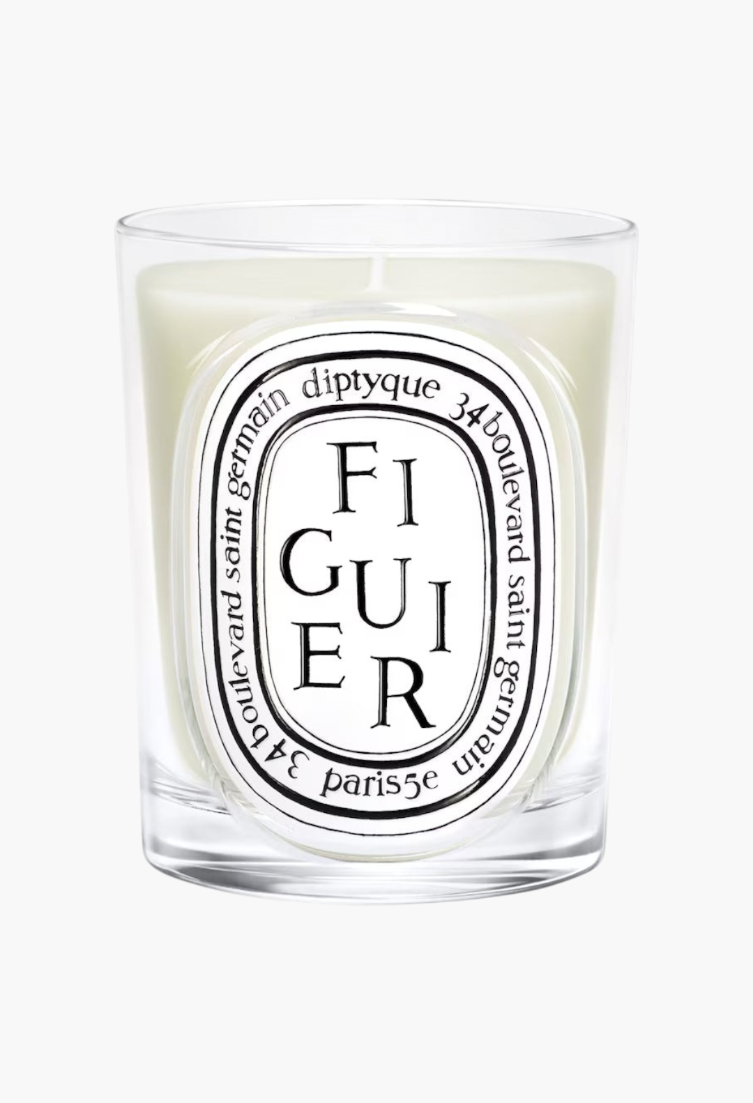 GLAM MODA Diptyque Figuier scented candle in a clear glass jar with a signature oval label and woody fig fragrance.