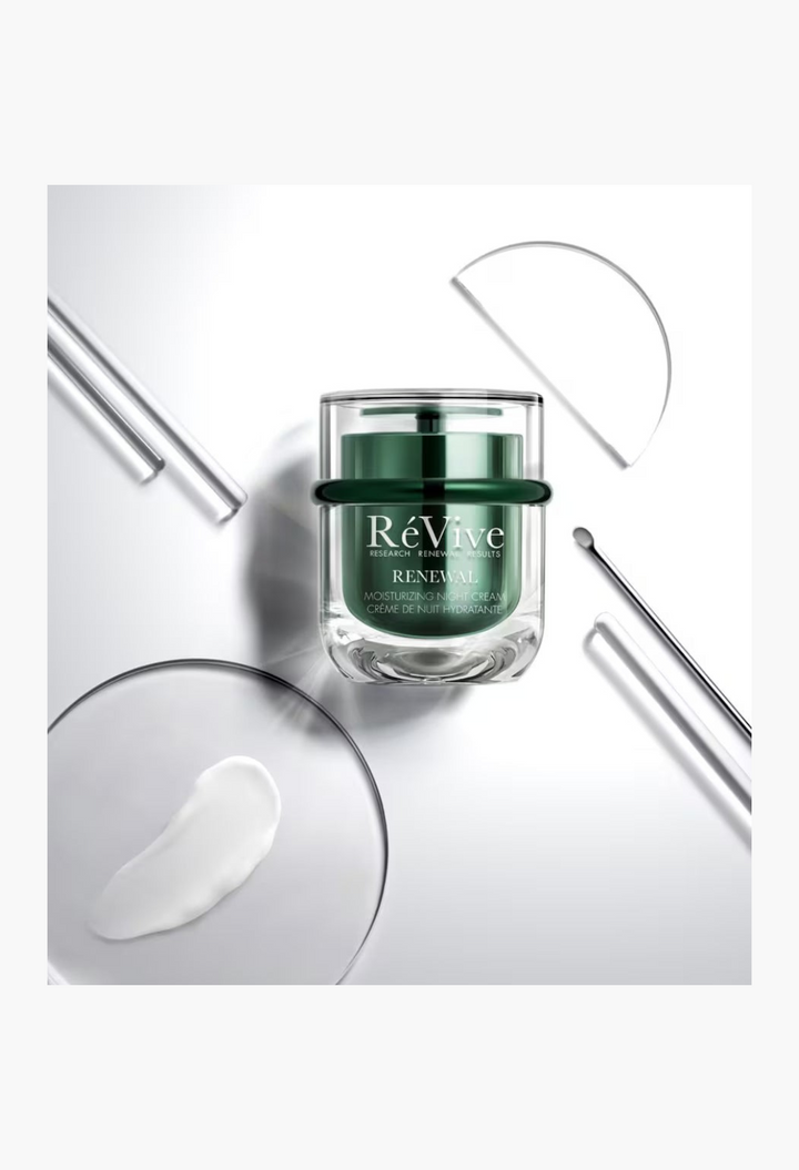 GLAM MODA RéVive Renewal Moisturising Night Cream in a green jar with a white cream sample on a glass surface.