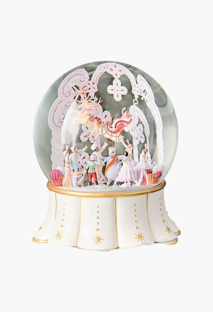 GLAM MODA New York City Ballet musical snow globe with hand-painted resin figures and a gold-accented ivory base.