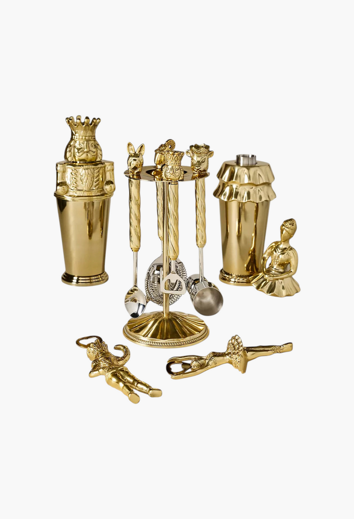 GLAM MODA Nutcracker-themed barware collection featuring gold-toned stainless steel shakers and ballet-inspired tools.