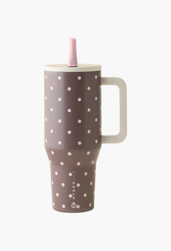 GLAM MODA brown stainless steel tumbler with white polka dots, handle, and pink flip-top straw.