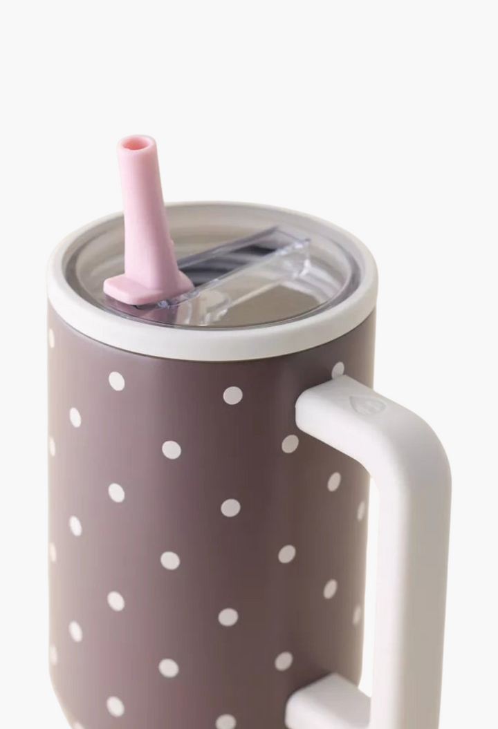 GLAM MODA stainless steel tumbler with a brown and white polka dot pattern, white handle, and pink flip straw lid.