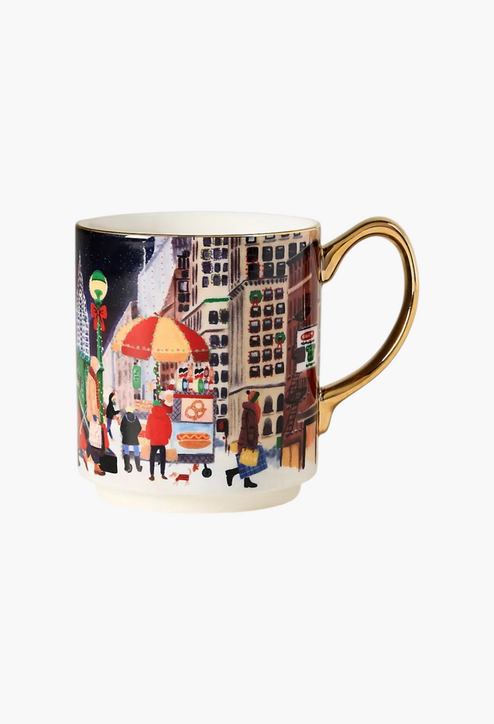 GLAM MODA stoneware mug featuring a festive city street scene with hand-painted gold handle and rim accents.