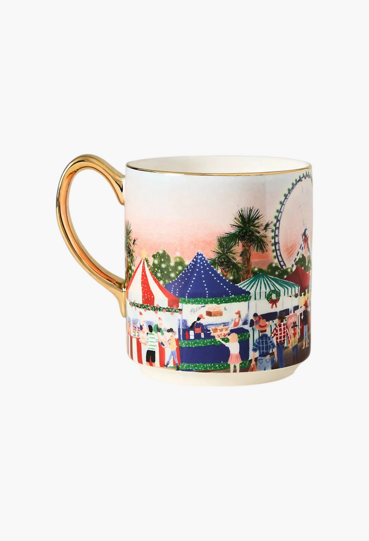 GLAM MODA Holiday in the City stoneware mug featuring a festive street market illustration and gold-painted handle.