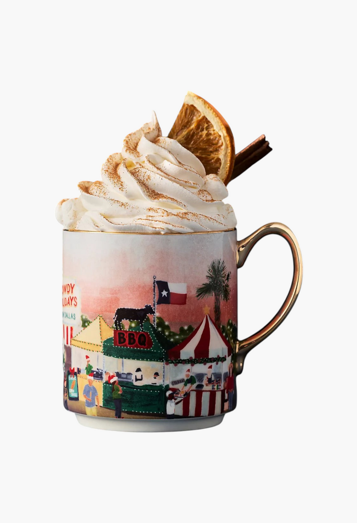 GLAM MODA Holiday in the City stoneware mug featuring a festive streetscape illustration and gold handle.