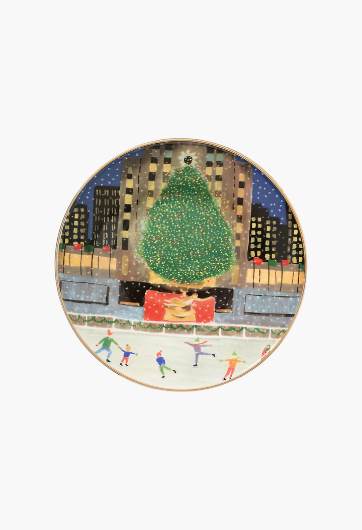 GLAM MODA Holiday in the City stoneware dessert plate featuring a festive New York ice skating scene with gold trim.