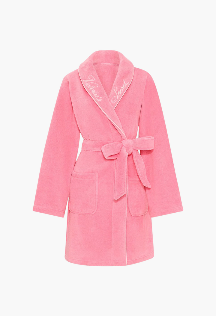 GLAM MODA pink plush robe with shawl collar, tie waist, and Victoria's Secret logo embroidery on the neckline.