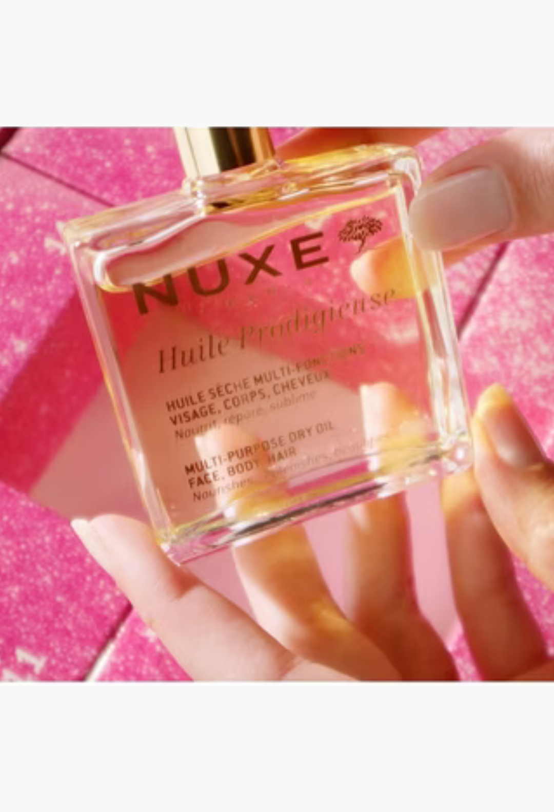 GLAM MODA Nuxe Advent Calendar featuring a bottle of Huile Prodigieuse multi-purpose dry oil for face, body and hair.