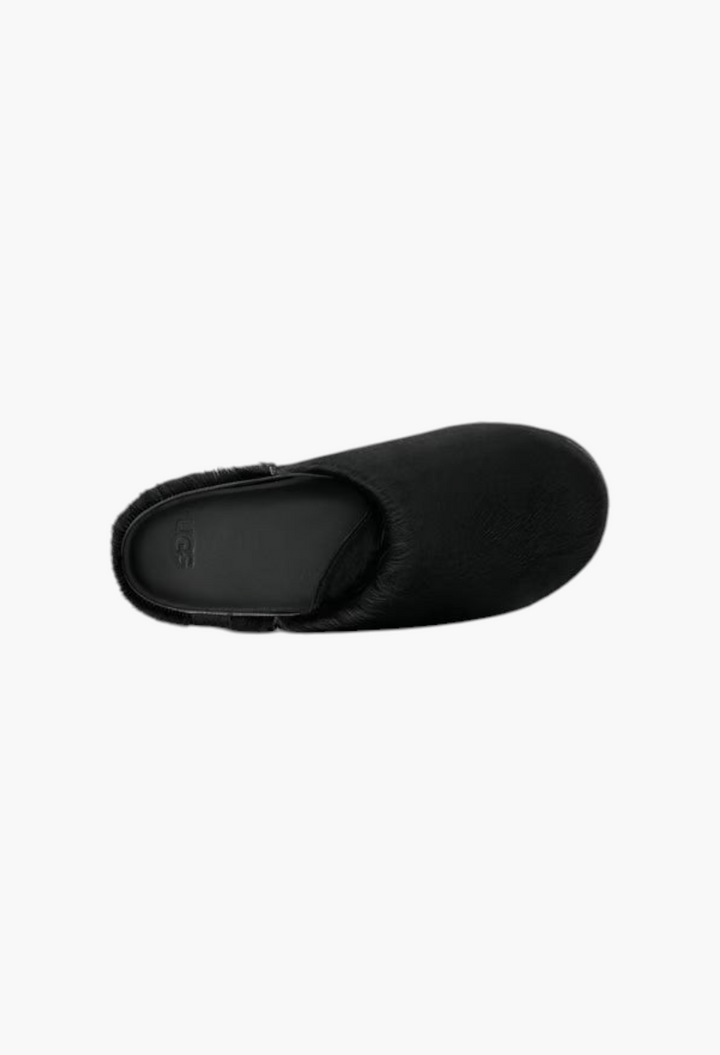 GLAM MODA Otzo black calf hair clog viewed from above, featuring a contoured footbed with embossed UGG logo.