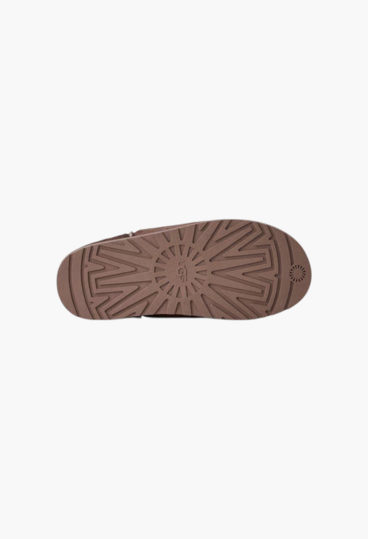 GLAM MODA Otzo calf hair clog showing the brown rubber outsole with signature UGG tread pattern