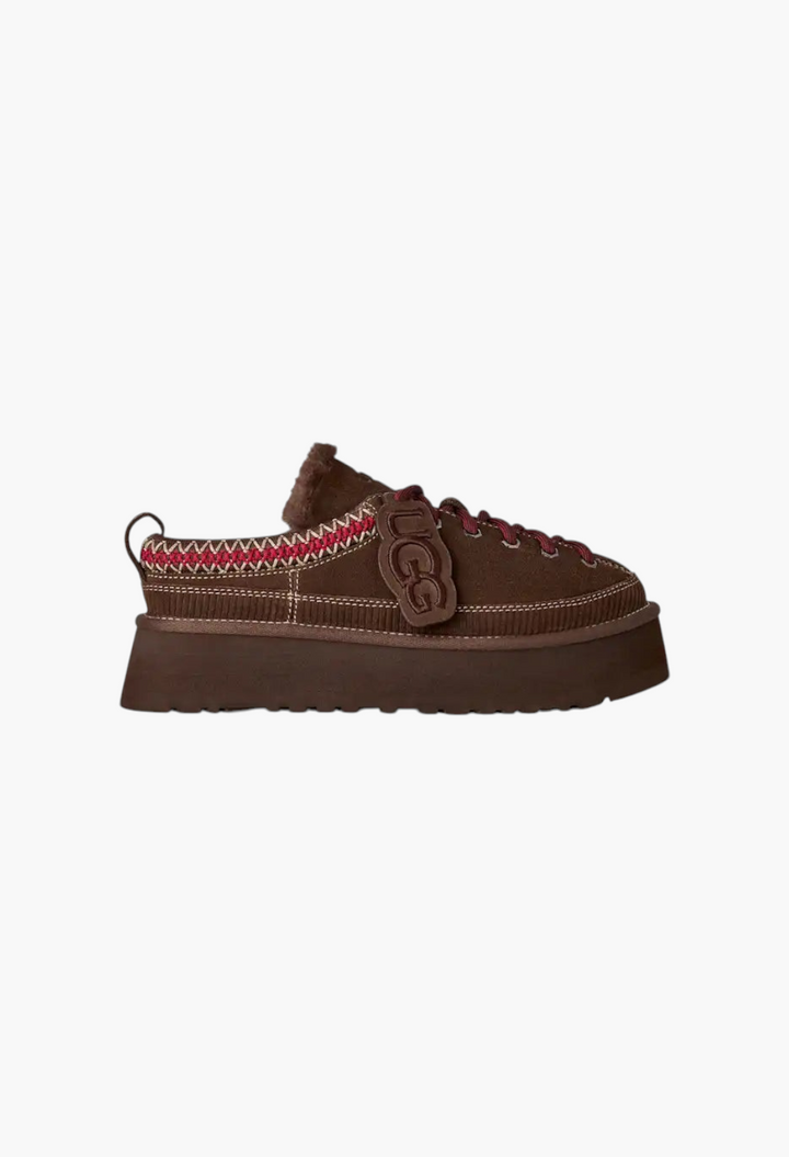 GLAM MODA brown suede lace-up platform slipper with sheepskin lining, UGGbraid detail, and removable logo charm.