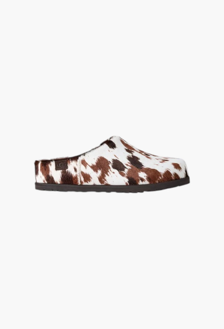 GLAM MODA Otzo Western Clog featuring a brown and white hand-painted cow hair upper and a durable rubber outsole.
