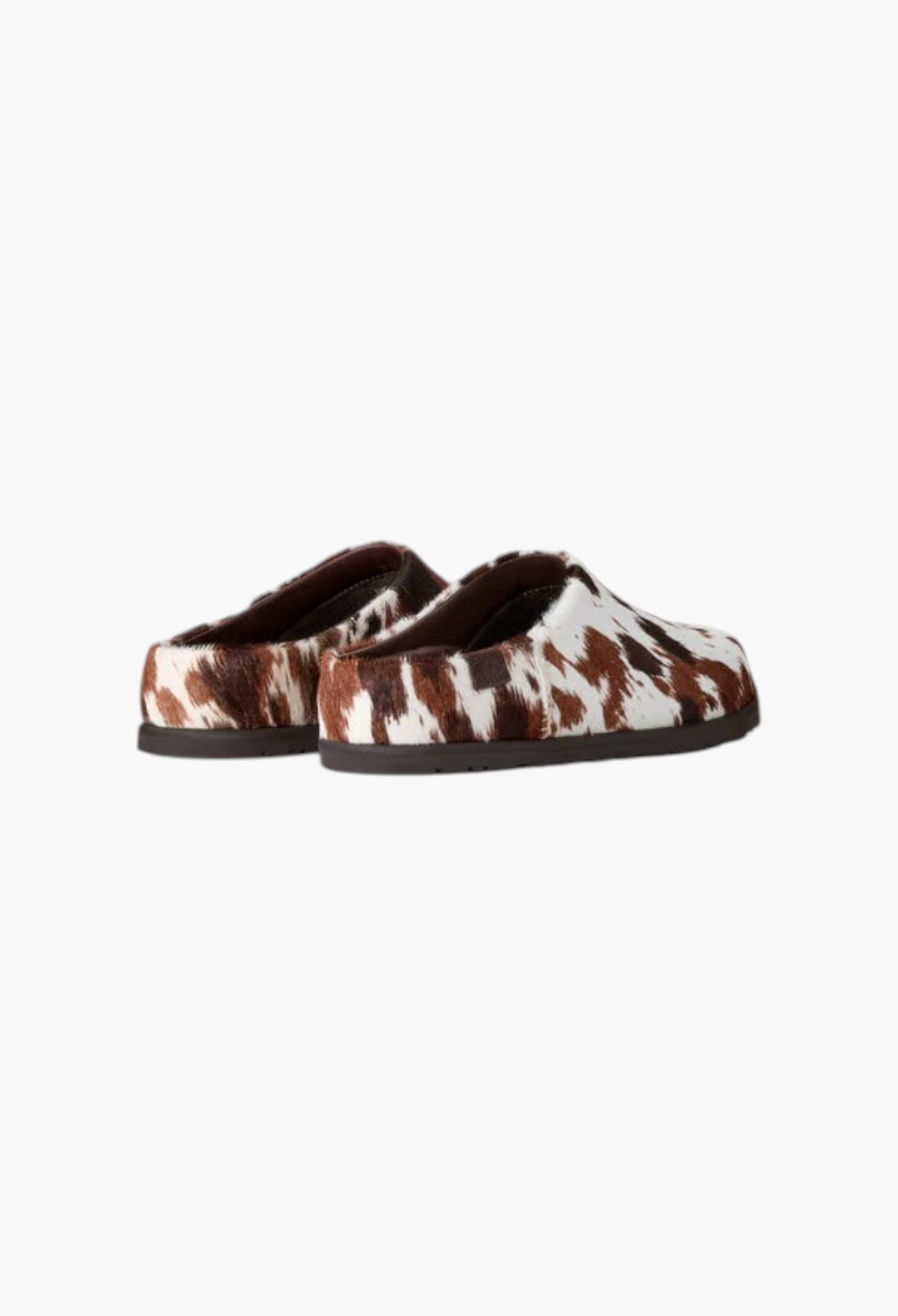 GLAM MODA Otzo Western Clog featuring a brown and white hand-painted cow hair upper with a durable rubber outsole.