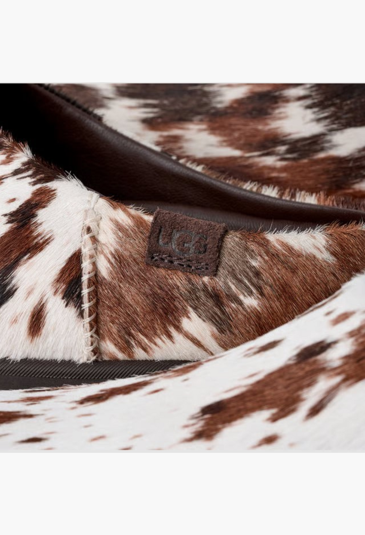 GLAM MODA Otzo Western Clog featuring hand-painted brown and white cow hair upper with embossed UGG logo leather tag