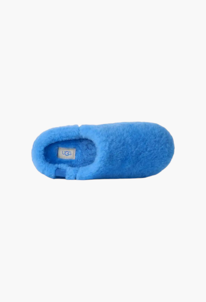 GLAM MODA bright blue sheepskin Elea Fluffed slip-on slipper with a cozy, minimalist design and UGG logo label.