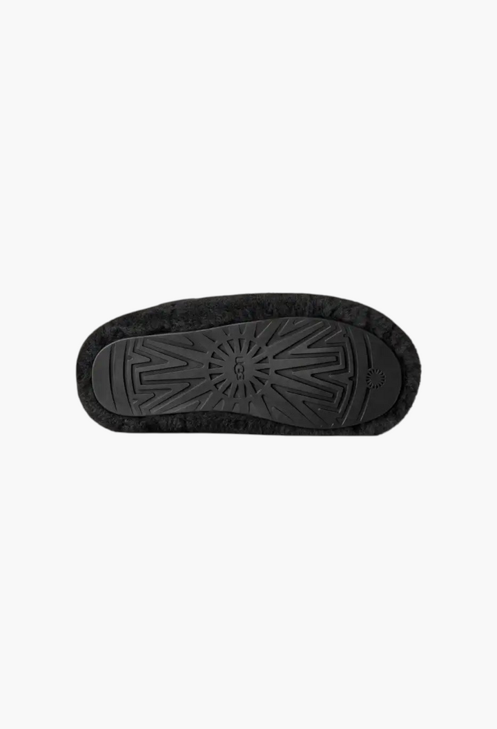 Black molded rubber outsole of the GLAM MODA Elea Fluffed Slip-On slipper featuring a geometric tread pattern