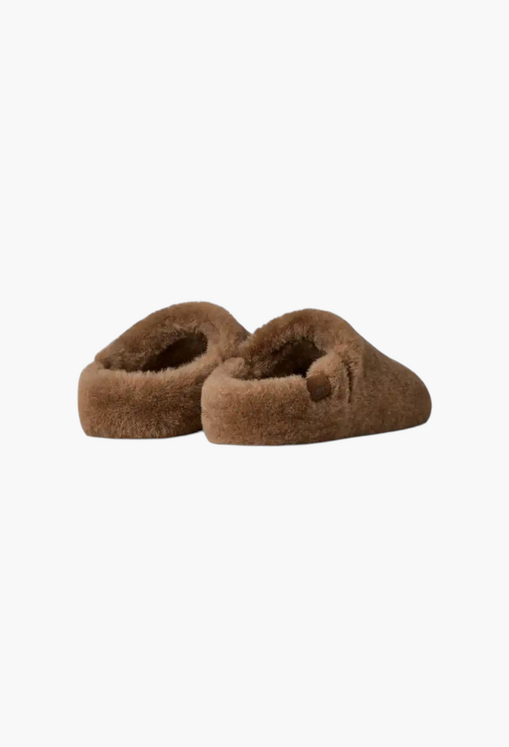 GLAM MODA Elea fluffed brown sheepskin slip-on slippers with a cozy minimalist design and durable rubber outsole.