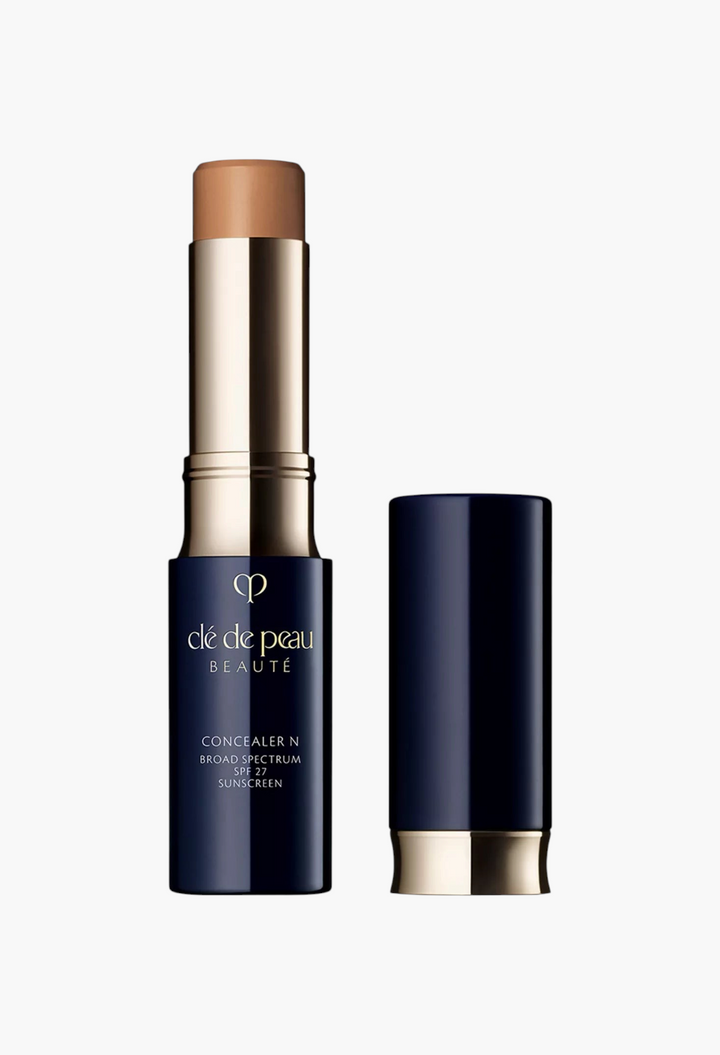GLAM MODA Concealer SPF 27 stick in a dark blue and gold tube, providing full coverage and sun protection.