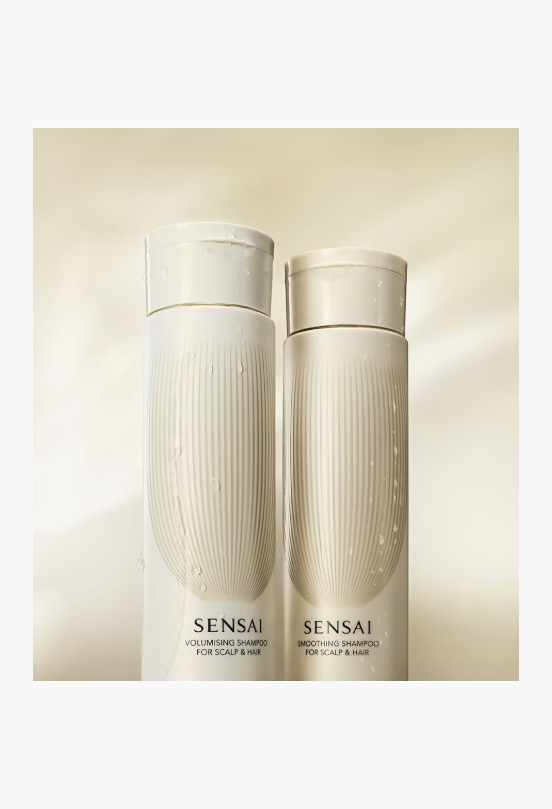 GLAM MODA SENSAI Volumising and Smoothing Shampoo bottles with elegant white packaging and water droplets.