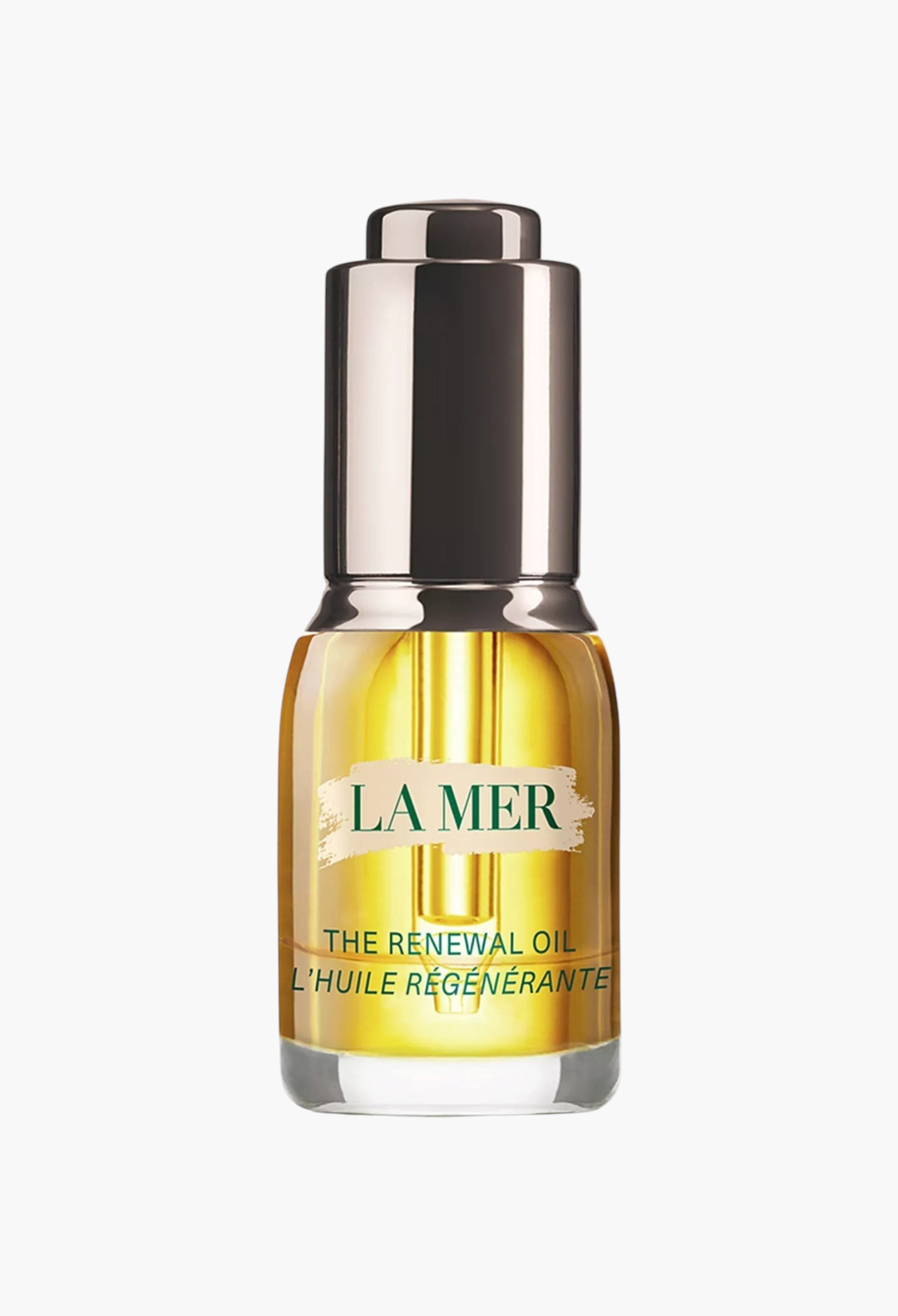 GLAM MODA La Mer The Renewal Oil in a clear glass bottle with a metallic dropper cap, showing golden facial oil.