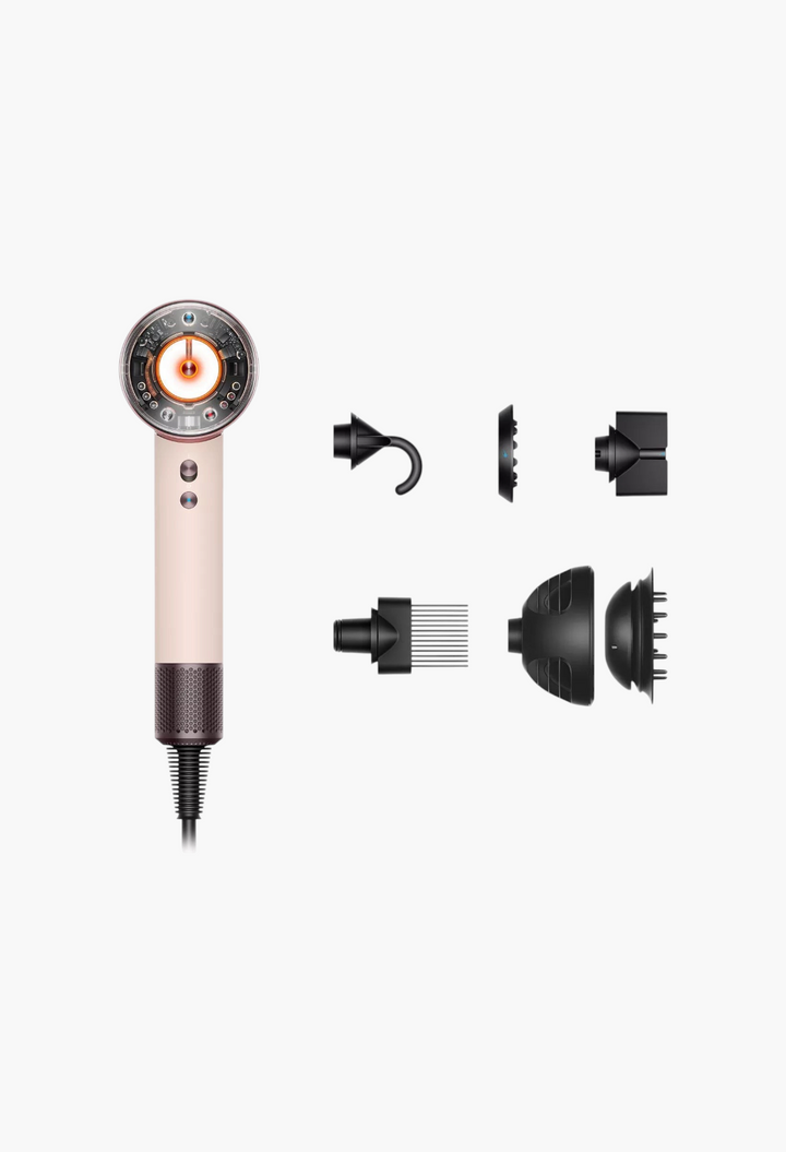 GLAM MODA Supersonic Nural hair dryer in rose gold with five magnetic styling attachments on a white background.