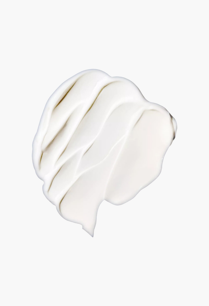 GLAM MODA The Rich Eye Cream with a thick, smooth white cream texture swatched against a deep blue background.