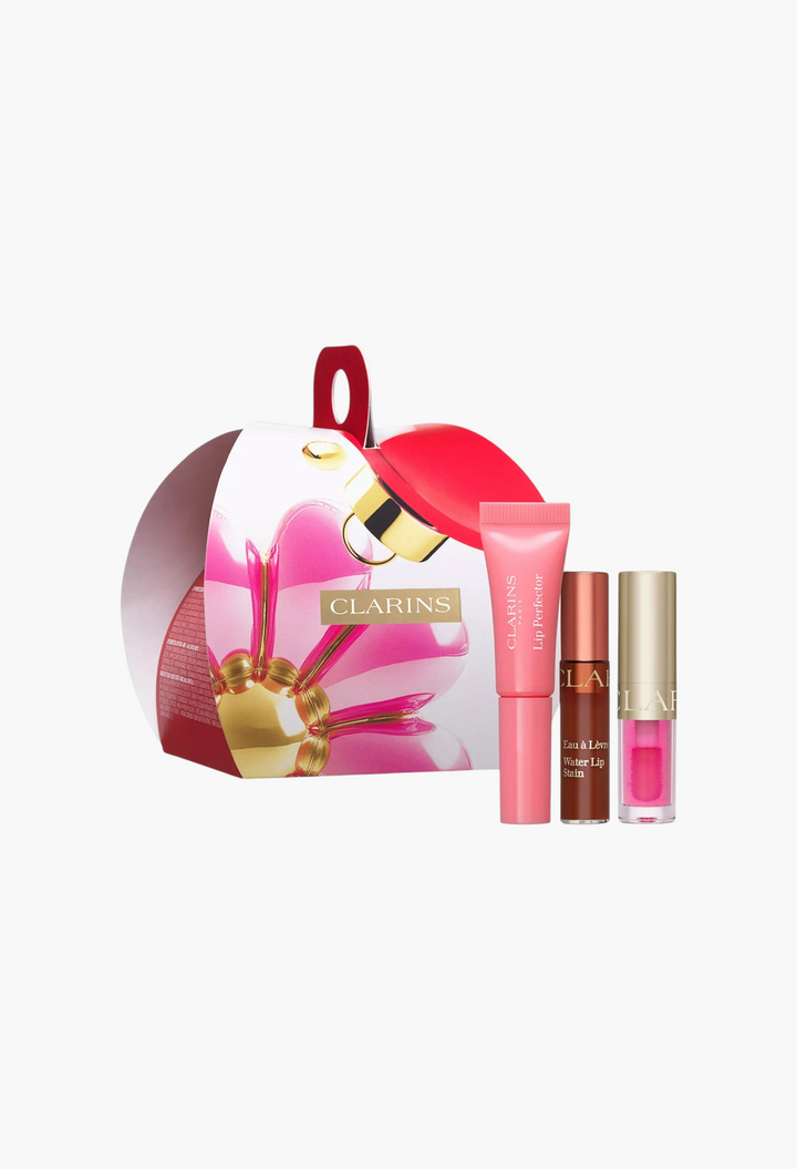 GLAM MODA The Mini Lip Hits Gift Set featuring a lip stain, lip oil, and lip perfector in festive holiday packaging.