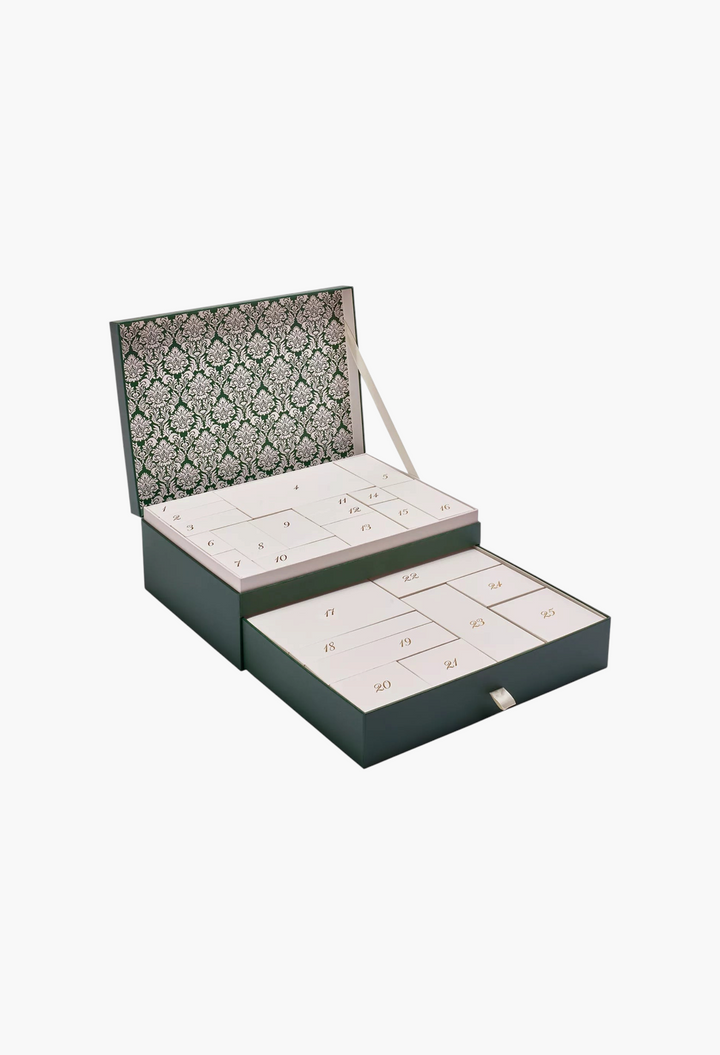 GLAM MODA 25-day luxury beauty advent calendar with a dark green exterior and elegant patterned interior lid