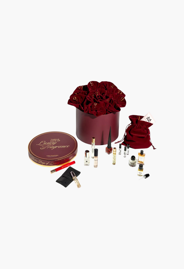 GLAM MODA 12 Days of Luxury Fragrance advent calendar featuring assorted designer perfume samples in velvet pouches.