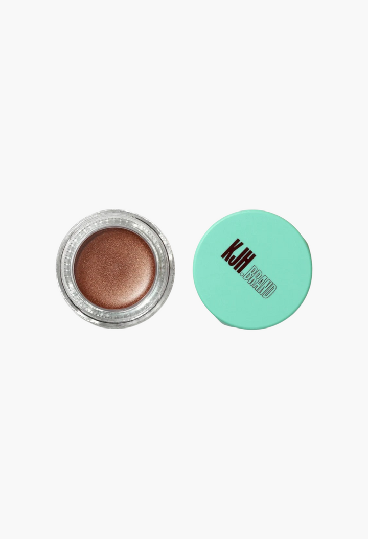 GLAM MODA Hyper Shine Lite Pigment in a bronze shimmer shade with a mint green lid, shown open from above.