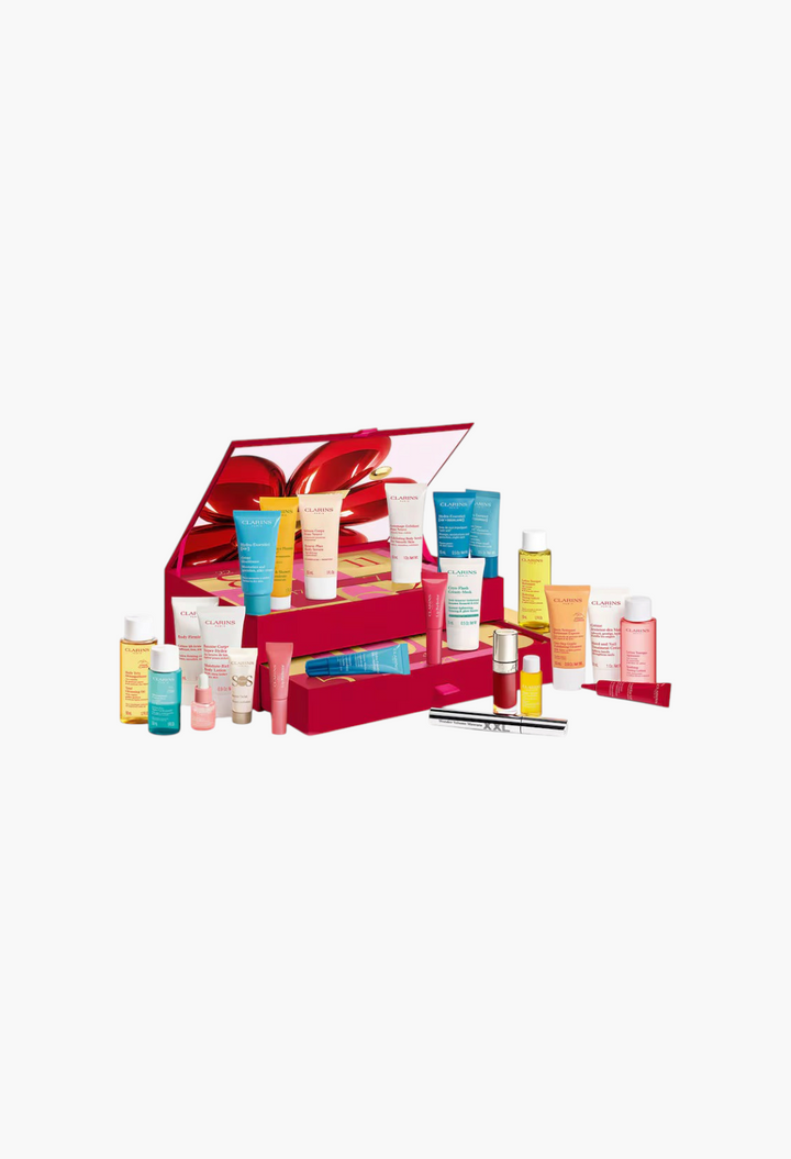 GLAM MODA Clarins 24-Day Beauty Advent Calendar featuring various skincare and makeup products in a red gift box.