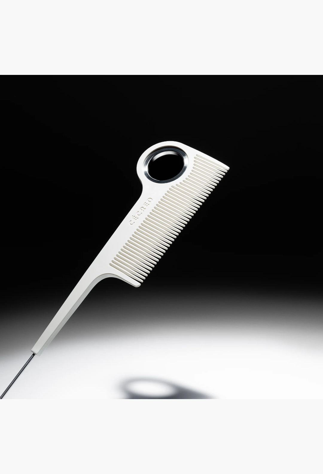 GLAM MODA parting tail comb with fine teeth, stainless steel tail, and a circular hanging ring for precision styling.