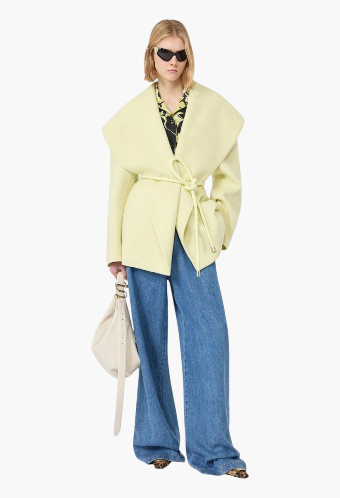 GLAM MODA pale yellow pure virgin wool jacket with wide shawl collar and tubular belt, worn with wide-leg jeans.