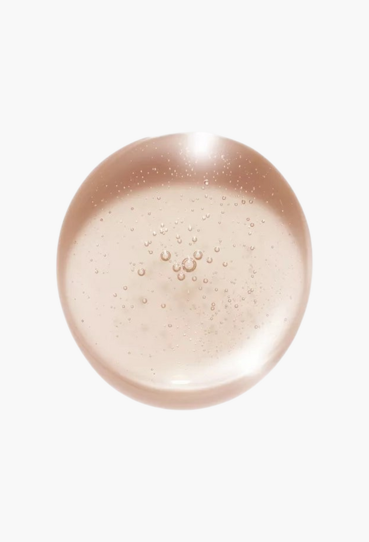 GLAM MODA Kerastase Gloss Absolu Glaze Drops, a clear, lightweight hair oil serum with a glossy texture.