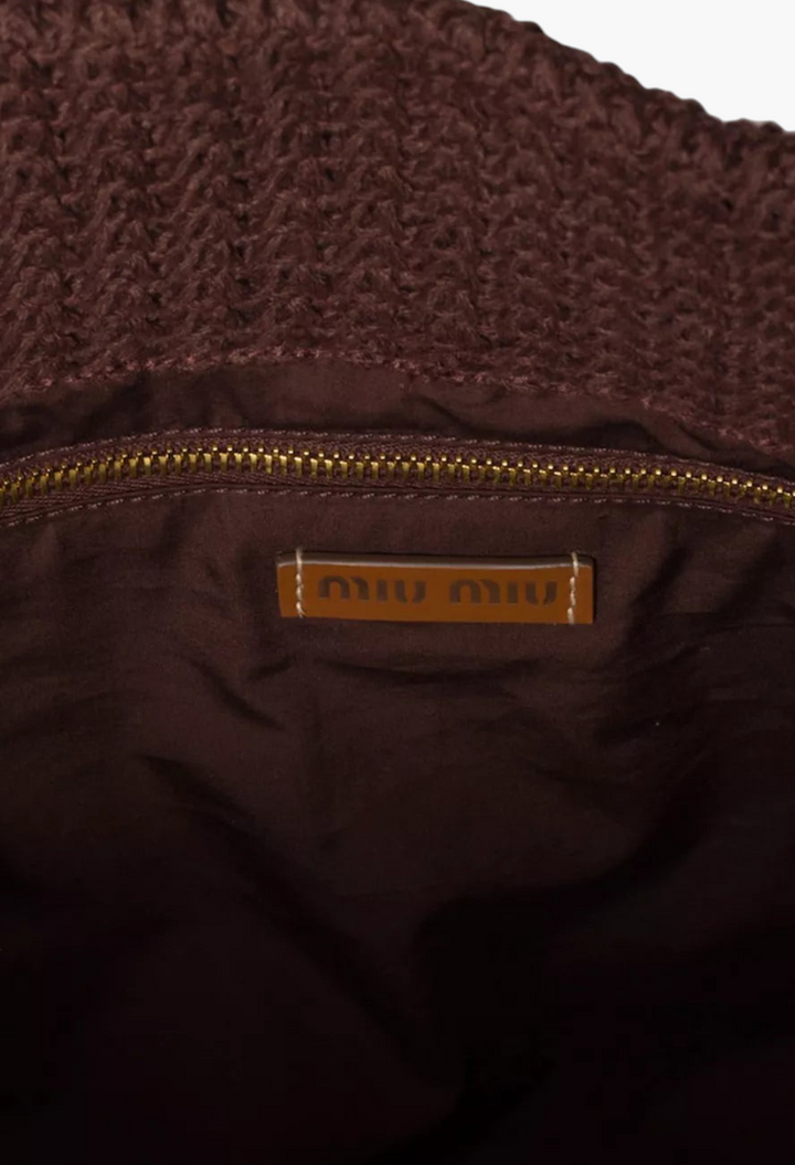 GLAM MODA brown raffia-effect tote bag interior featuring a gold zipper and Miu Miu leather logo patch