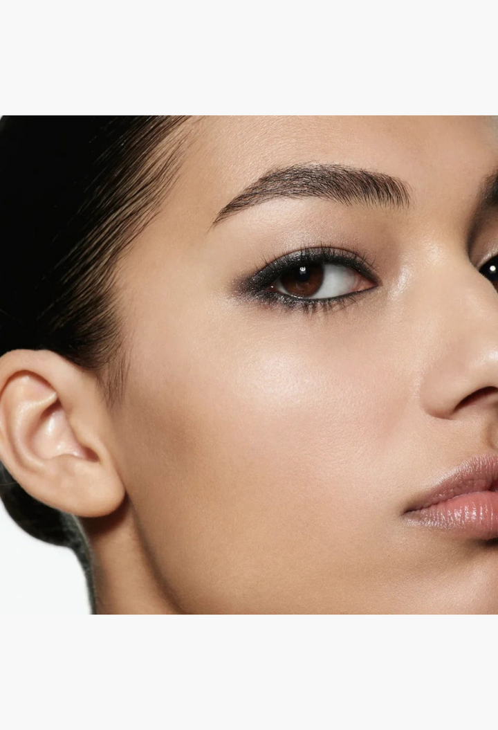 Close-up of a model wearing dark, smoky eyeshadow from the GLAM MODA Eye Wardrobe palette, showcasing a blendable finish