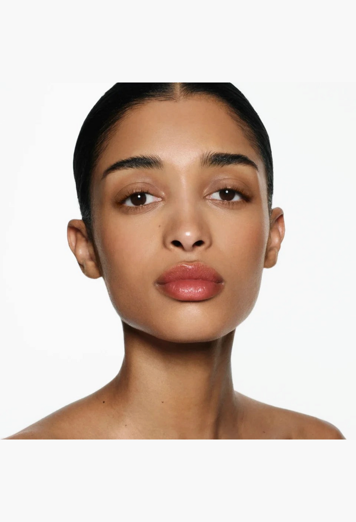 GLAM MODA Posh Balm Nourishing Lip Shine on a model with a natural, glossy, and hydrated finish.