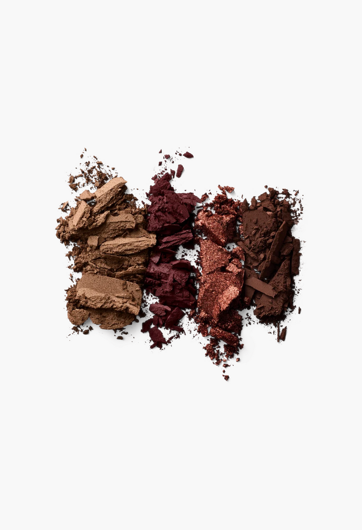 GLAM MODA Eye Wardrobe eyeshadow palette swatches in warm beige, matte tan, metallic bronze, and deep brown shades.