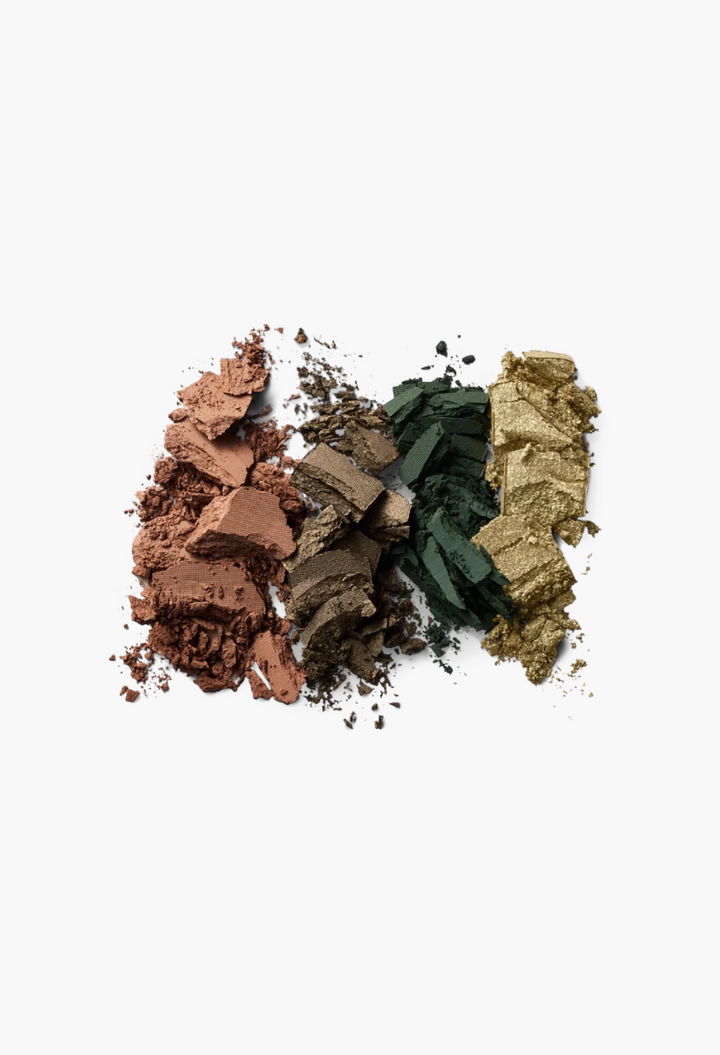 GLAM MODA Eye Wardrobe eyeshadow palette swatches in warm brown, olive green, and metallic gold powder textures.