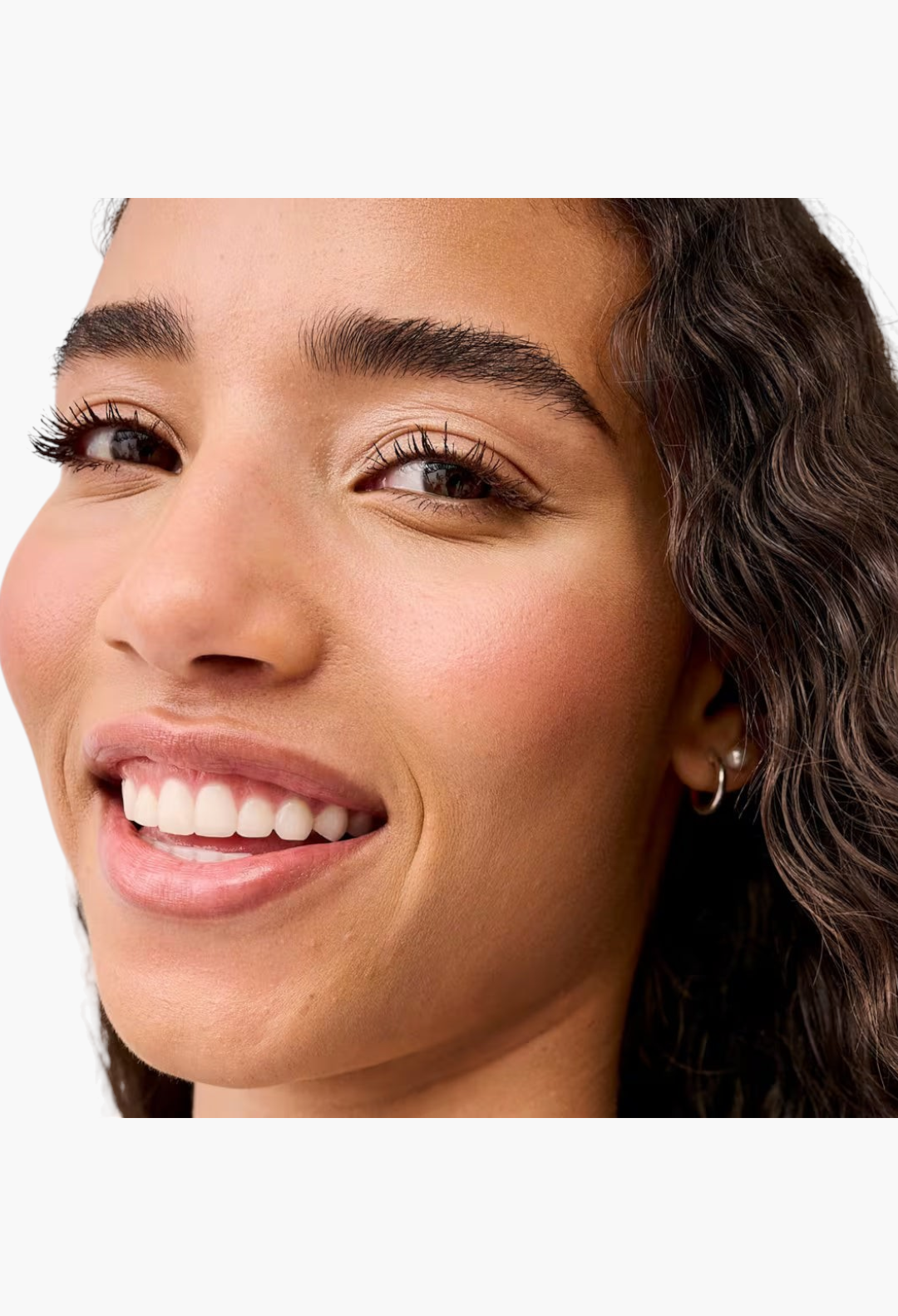 GLAM MODA model with long, volumized lashes wearing BADgal BANG! volumizing mascara for a dramatic lifted look