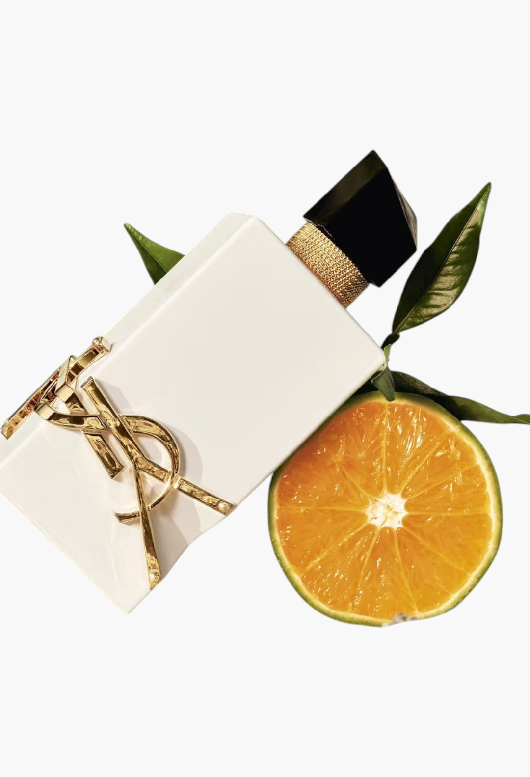 GLAM MODA Yves Saint Laurent Libre L’Eau Nue perfume bottle in white with gold logo next to a fresh orange slice