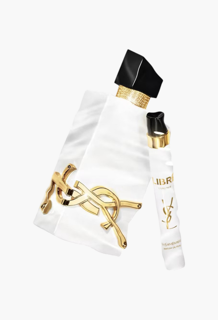 GLAM MODA Yves Saint Laurent Libre L’Eau Nue alcohol-free perfume bottle and travel spray on a water-like background.