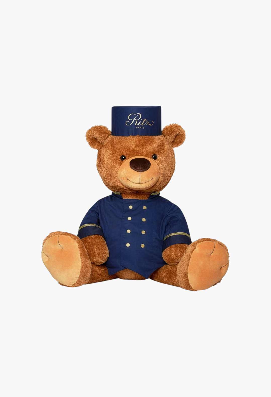 GLAM MODA large brown teddy bear dressed as a Ritz Paris bellboy with a navy blue uniform and matching pillbox hat.