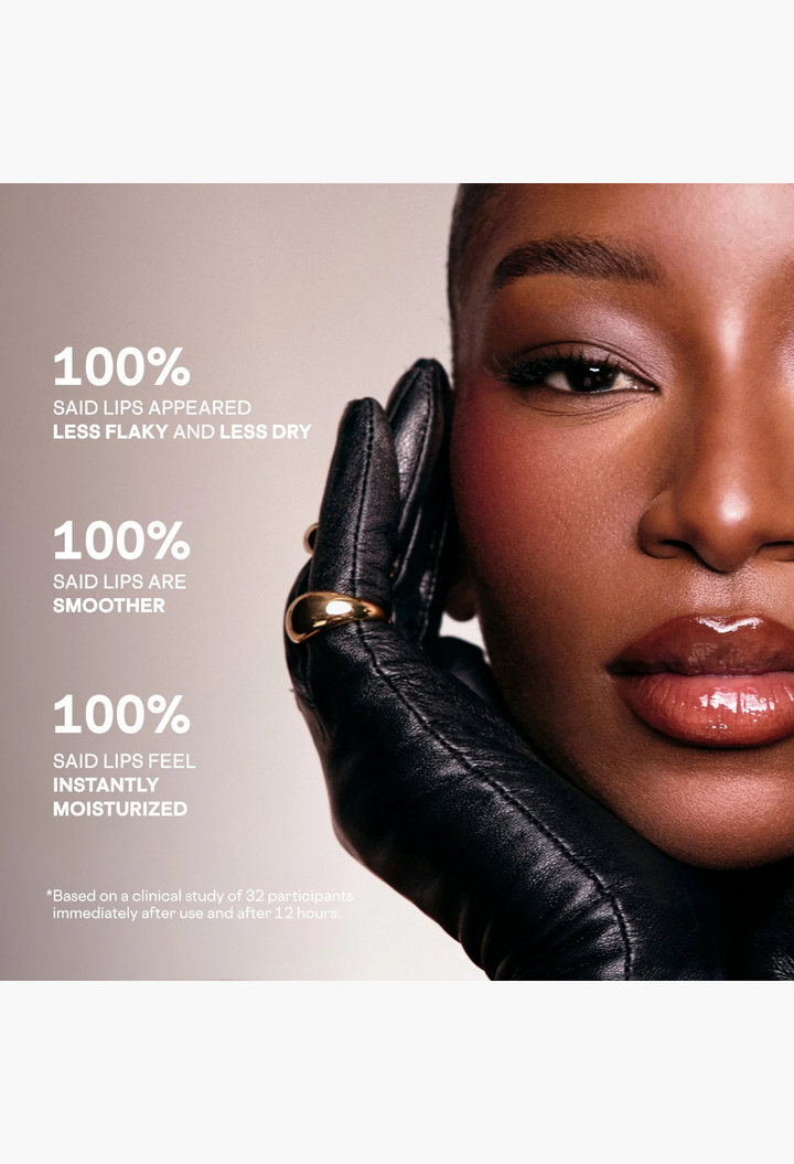 GLAM MODA Mini Major lip balm on a model with glossy, moisturized lips wearing black leather gloves