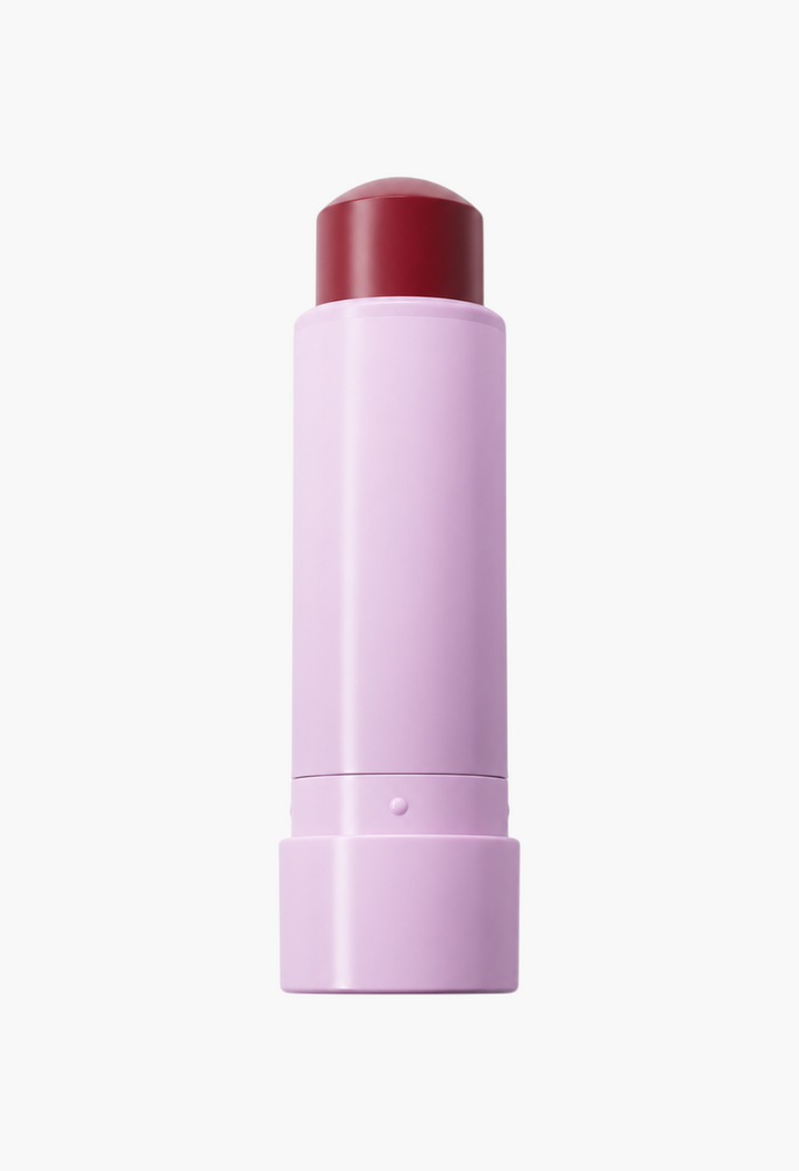 GLAM MODA The Soft Smudge cream-to-powder multi-use stick in a deep berry shade with a light purple casing.
