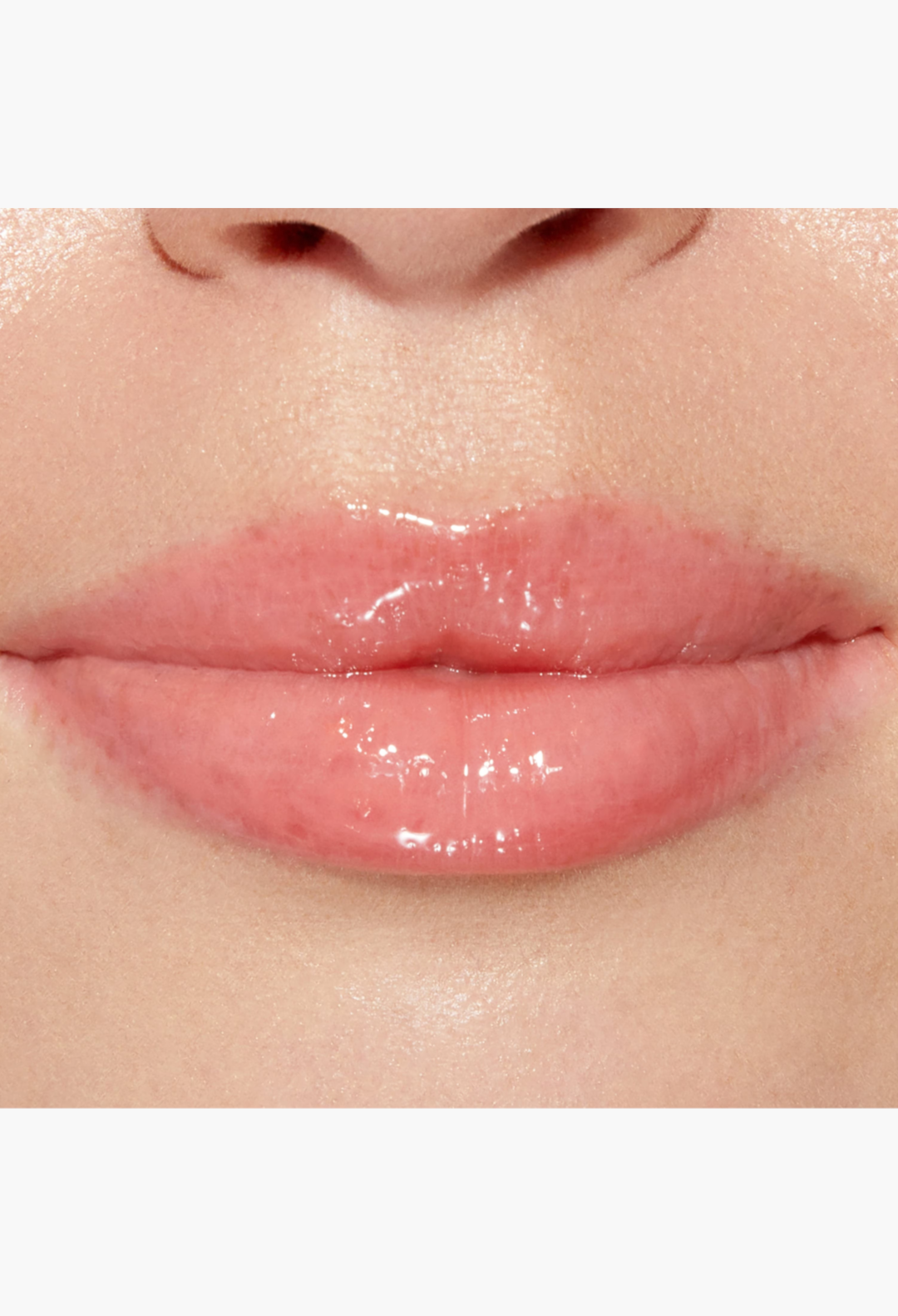 GLAM MODA Lip Injection Power Plumping Lip Gloss in a clear shade with rainbow sparkle applied on lips