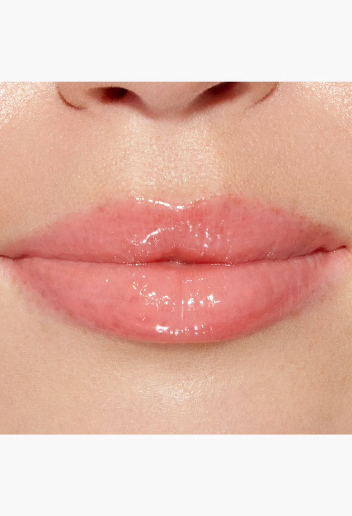 GLAM MODA Lip Injection Power Plumping Lip Gloss in a clear shade with rainbow sparkle applied on lips