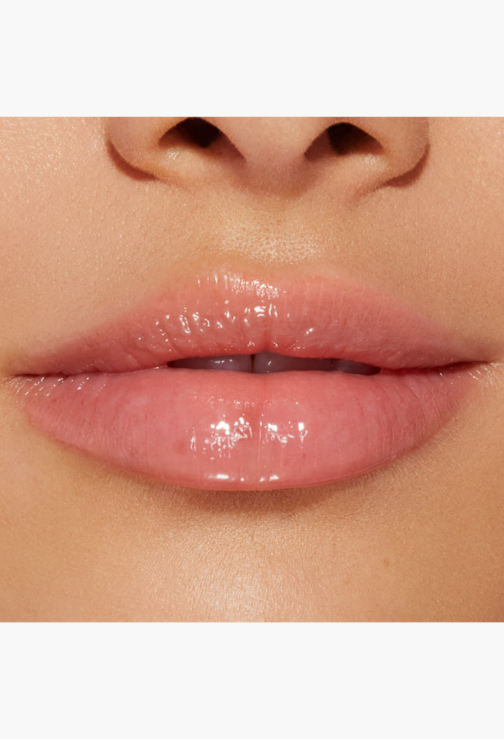 GLAM MODA Lip Injection Power Plumping Lip Gloss in a clear, high-shine finish with subtle rainbow sparkle.