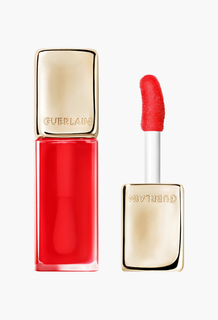 GLAM MODA Guerlain KissKiss Bee Glow Oil in Poppy Glow red shade with gold cap and plush applicator