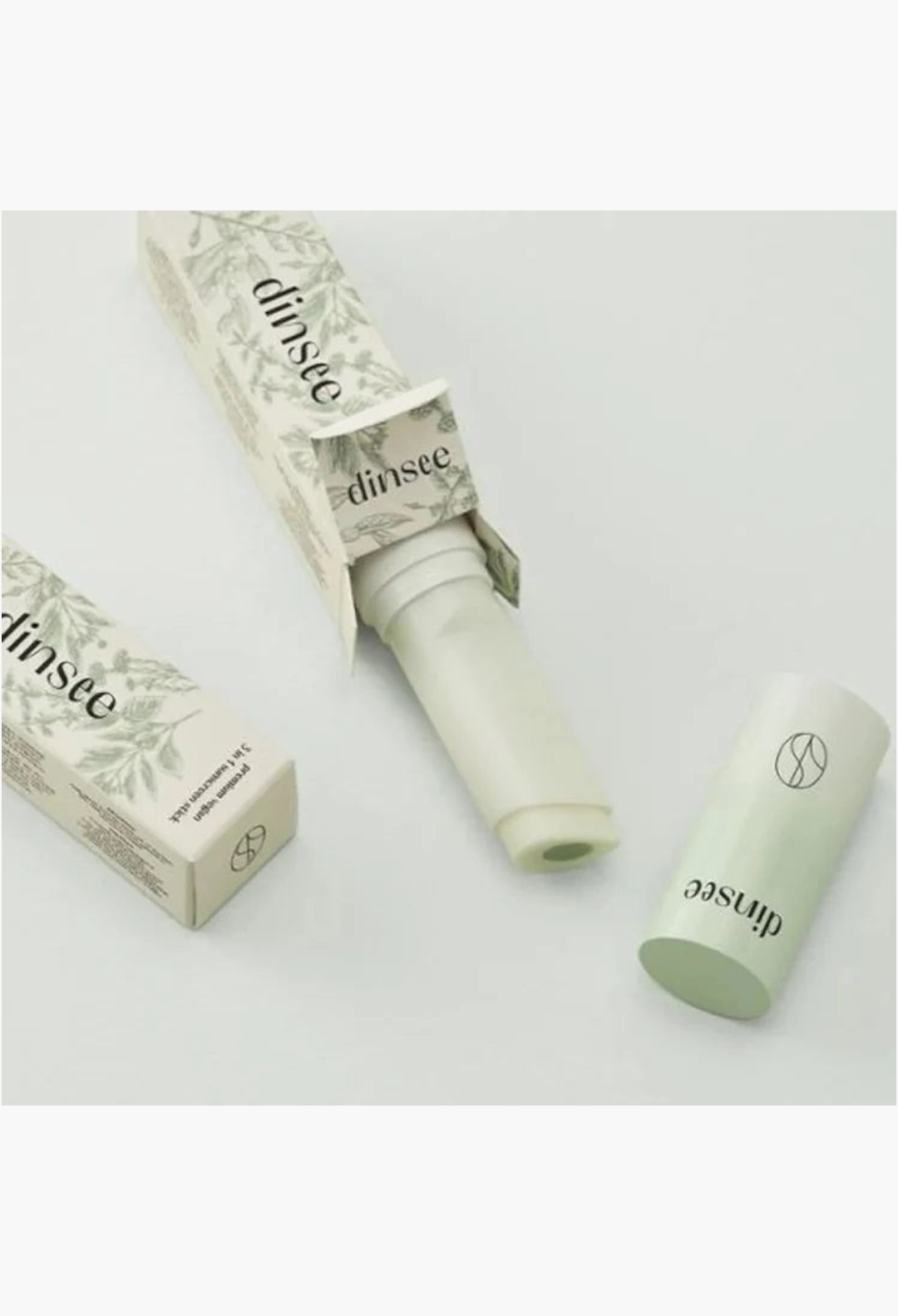 GLAM MODA Dinsee vegan 3-in-1 sunscreen stick with SPF50+ PA++++ in light green packaging with botanical illustrations